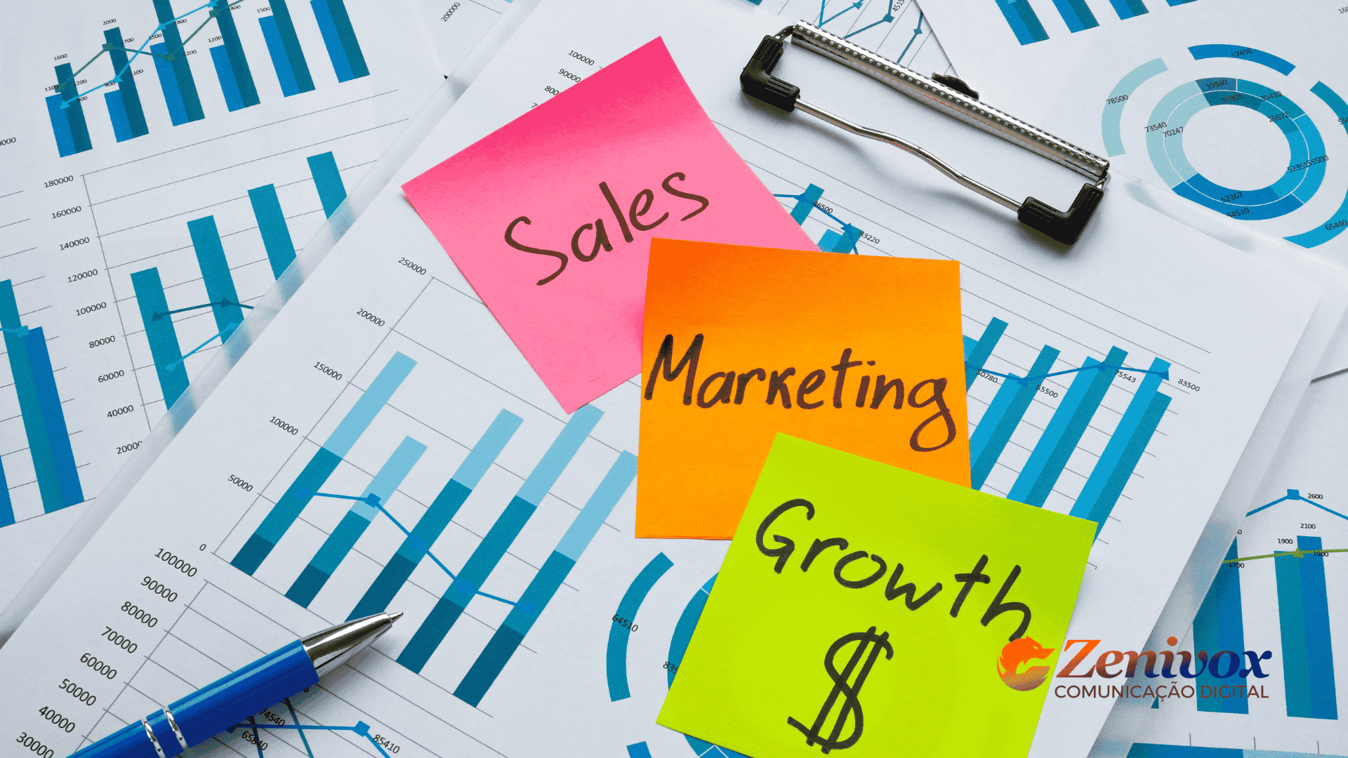 Imagem com graficos em uma mesa com post de Sales, Marketing e Grouth