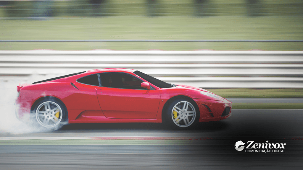 Imagem de um carro esportivo vermelho em alta velocidade em uma pista de corrida, com um rastro de fumaça nas rodas traseiras, simbolizando movimento e potência. O fundo desfocado reforça a sensação de velocidade e foco no desempenho. Simbolizando o marketing de segmentação da Ferrari. No canto inferior direito, o logotipo da Zenivox Comunicação Digital está presente.