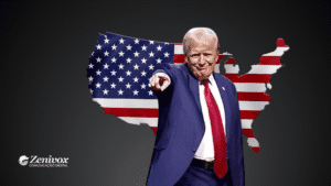 Montagem digital com fundo preto mostrando a silhueta do mapa dos Estados Unidos com a bandeira americana estampada. Em destaque à frente, Donald Trump em terno azul marinho, gravata vermelha e expressão determinada, apontando diretamente para o observador, simbolizando o tarifaço do Trump. No canto inferior esquerdo, a marca "Zenivox Comunicação Digital".