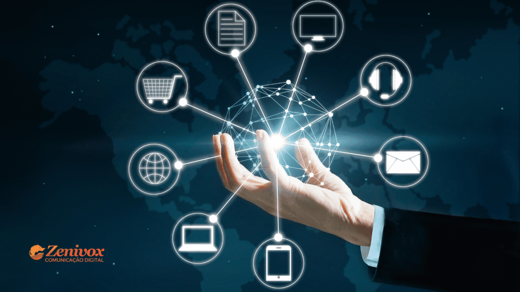 Imagem conceitual sobre os diferentes tipos de canais de vendas, com uma mão segurando uma rede digital conectada a ícones que representam loja virtual, e-mail, atendimento, dispositivos móveis, computadores e outros pontos de contato com o cliente. Ao fundo, mapa-múndi e a marca Zenivox Comunicação Digital.